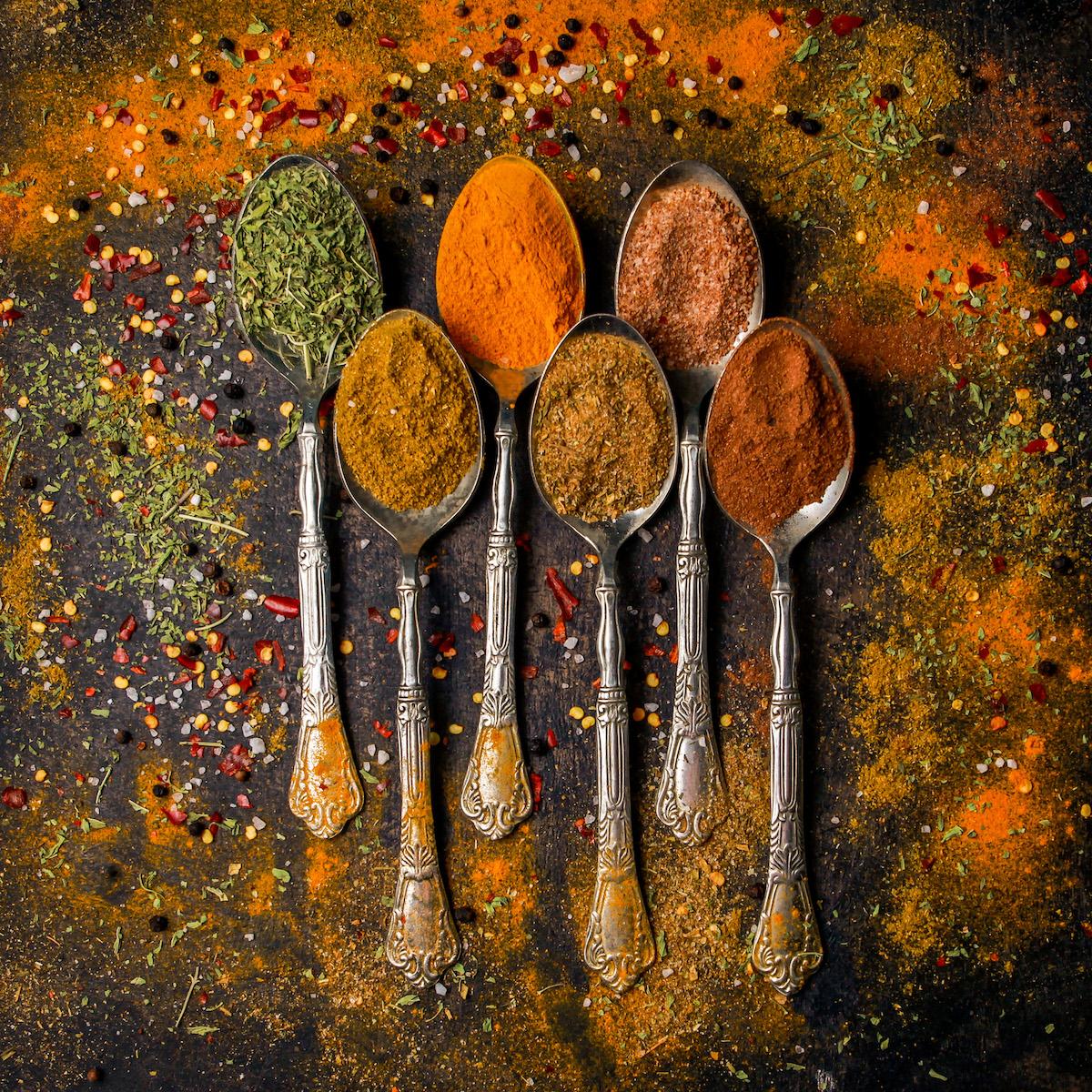 top view spice with pepper cinnamon turmeric spoon 1