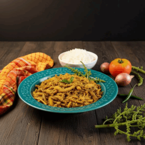 Spined Anchovy Fish Stir-Fry with Hog Plum Buds (Amrar Mukul diye Kata Phasa Machher Chorchori)